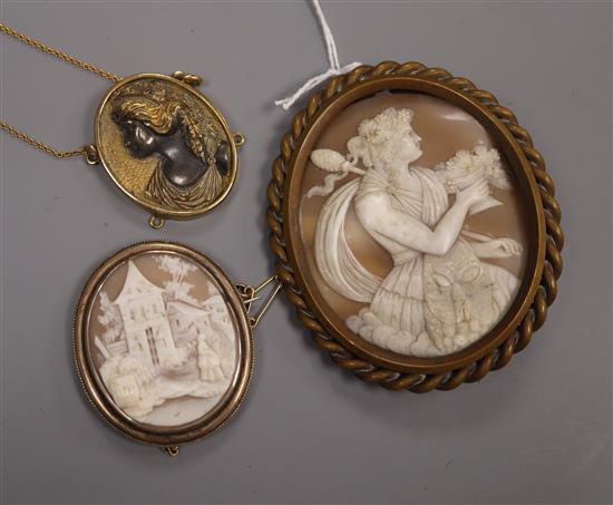 A large gilt metal mounted cameo brooch depicting a Bacchante, another smaller cameo brooch and a gilt metal pendant, largest 78mm.